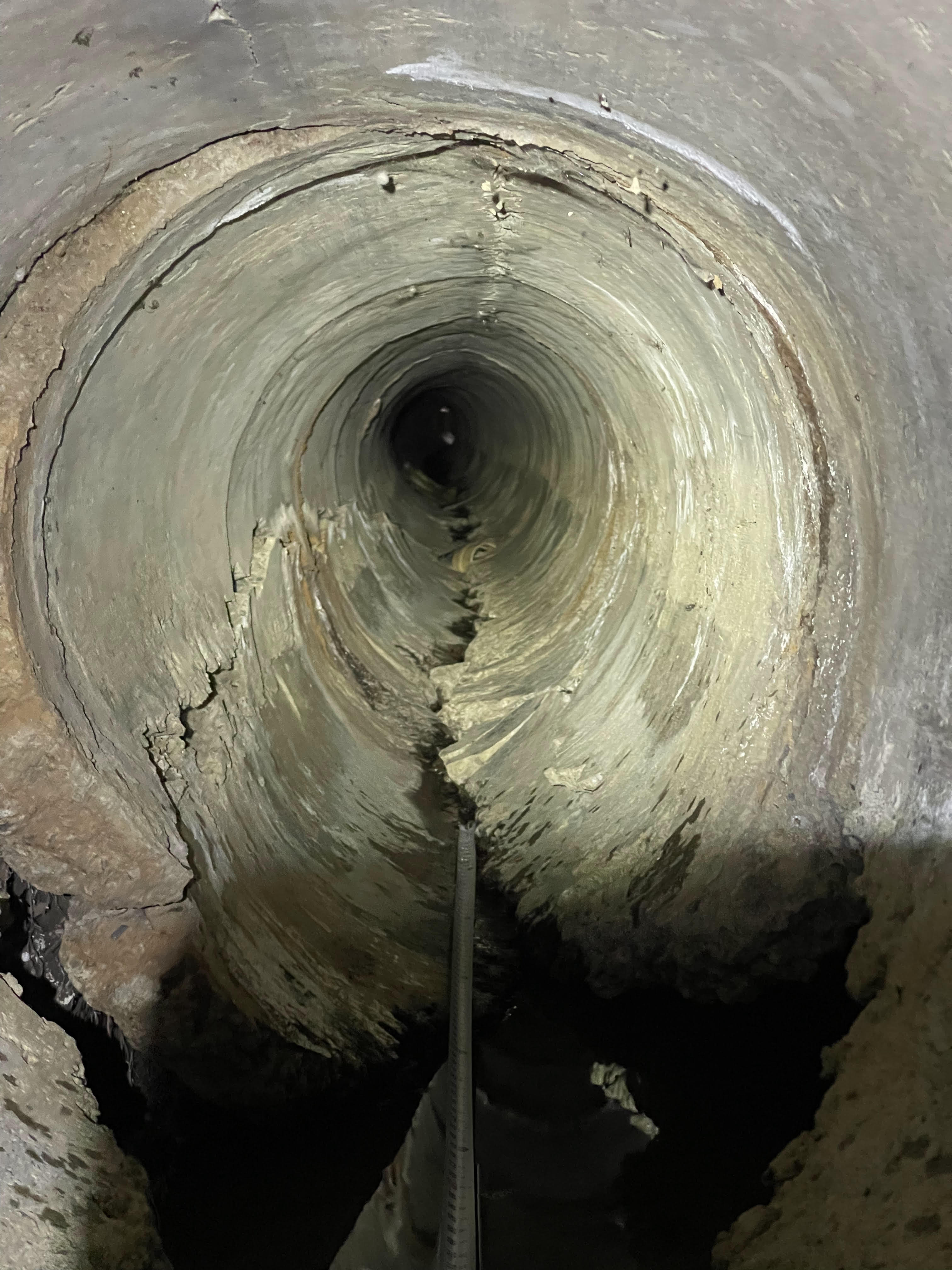 Interior view of a deteriorated pipe captured during CCTV inspection